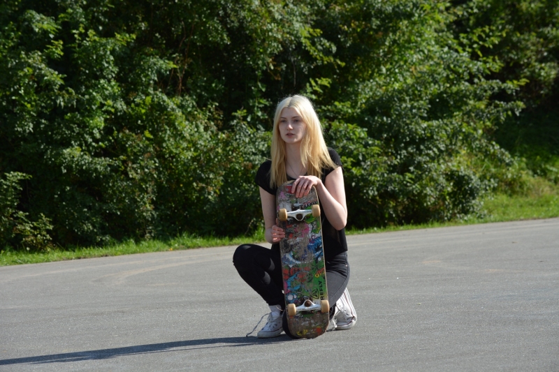 Woman-with-Skateboard